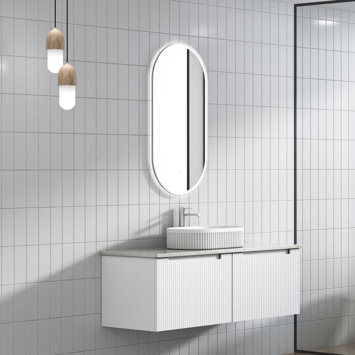 Bathroom with white tiled walls, a vanity unit, and a mirror.