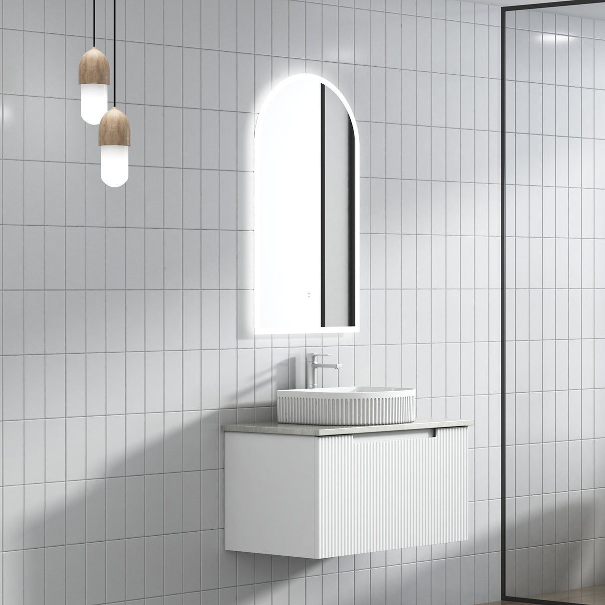 Bathroom with white tiled walls, a vanity unit, and a mirror.