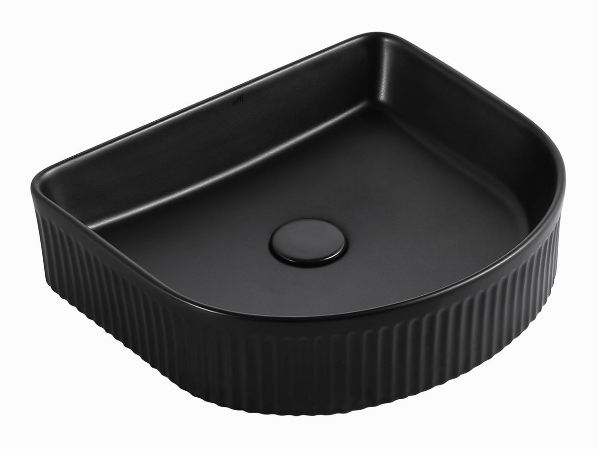 A black ceramic sink with vertical ridges.