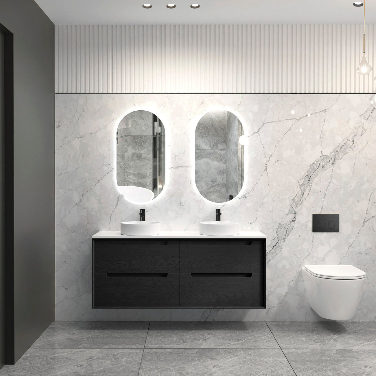 Modern bathroom with black vanity, white sink, and marble walls.