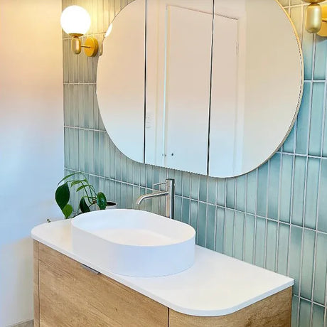 Bathroom with mounted shaving cabinet and wall hung vanity