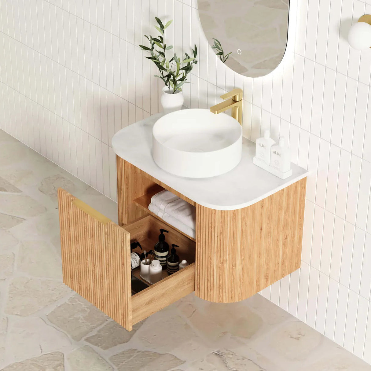 Bathroom vanity with wooden cabinet, white countertop, and decorative items.