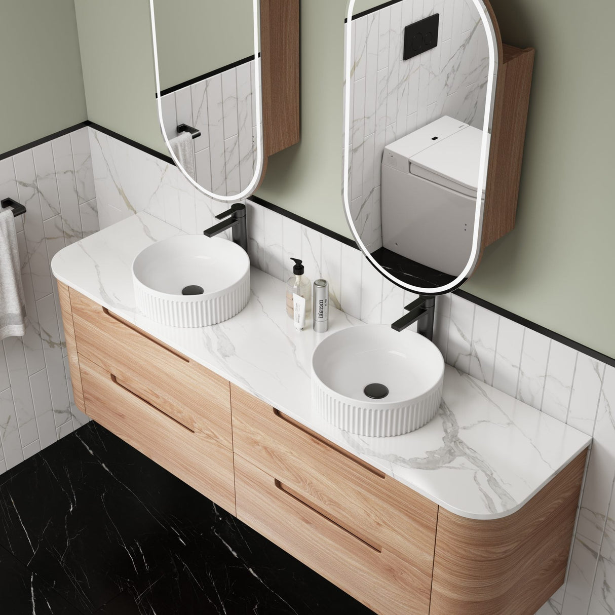 Bathroom vanity with double sink, mirrors, and wooden cabinets.