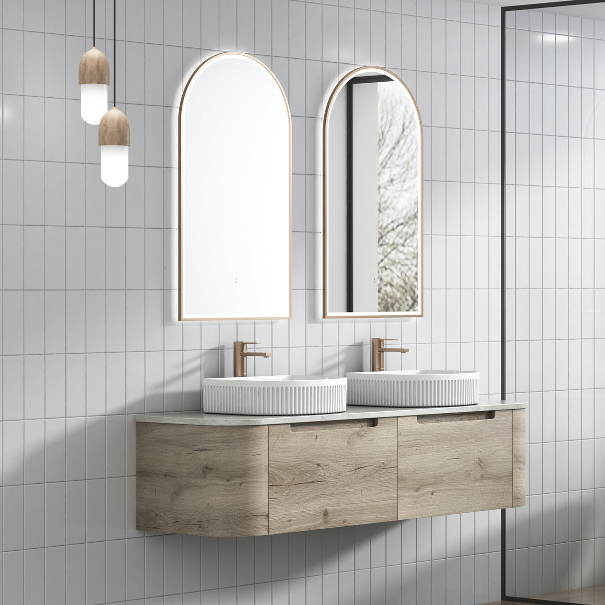 Bathroom vanity with double sink and mirrors on a tiled wall.