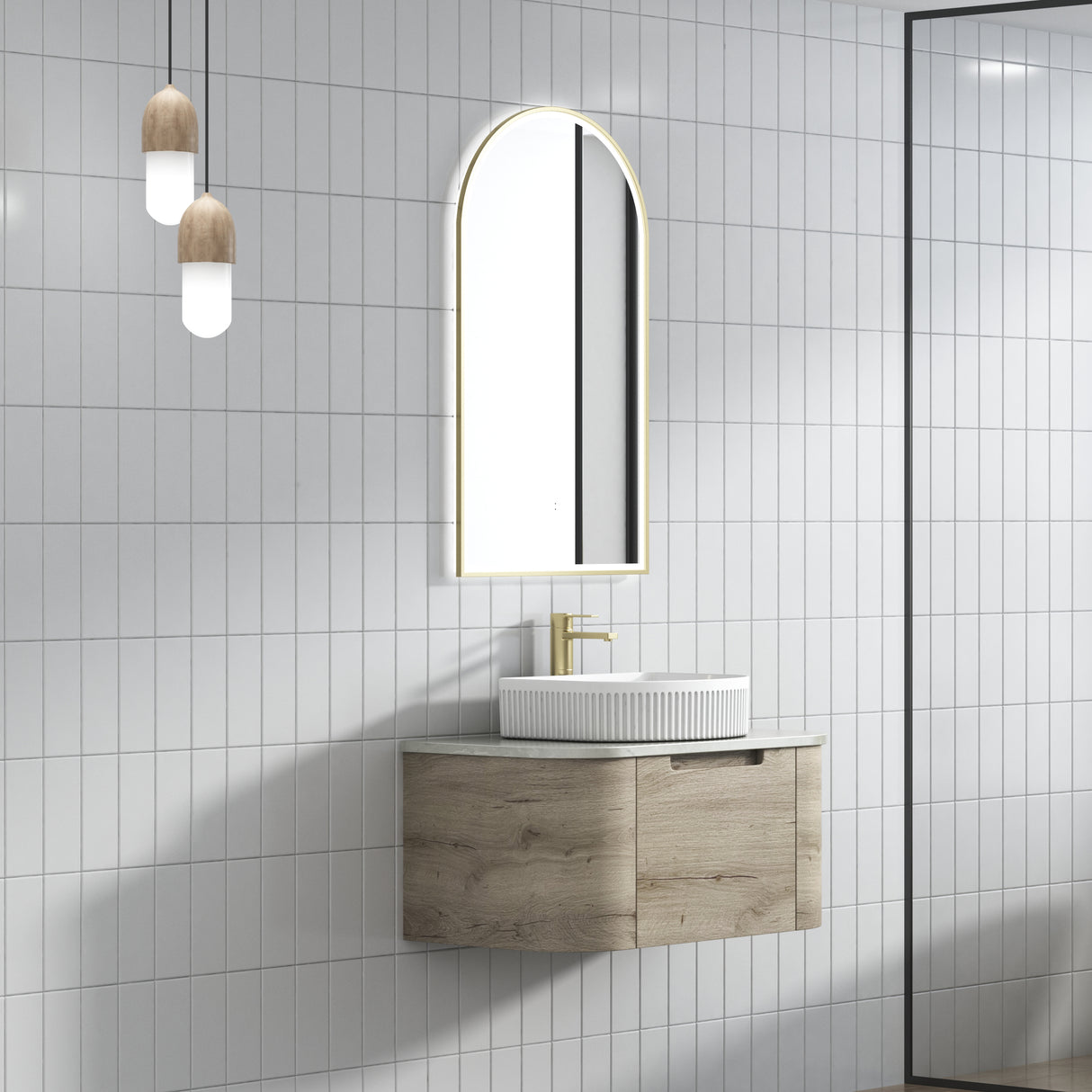 Bathroom with wooden vanity, sink, and arch-shaped mirror with lights.