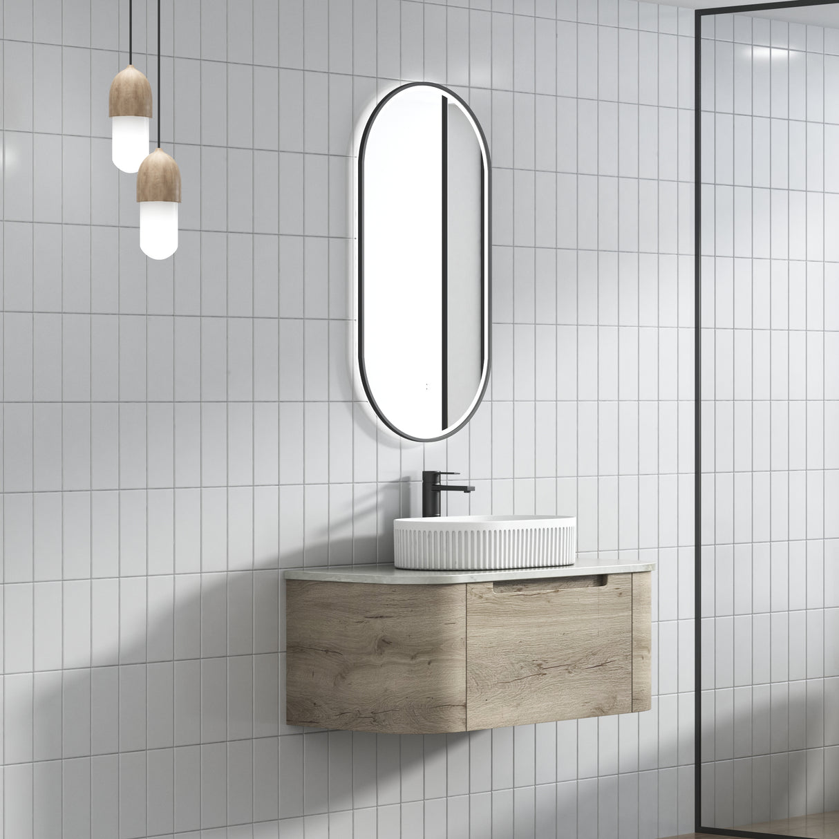 Bathroom with wooden vanity, sink, and mirror against a tiled wall.