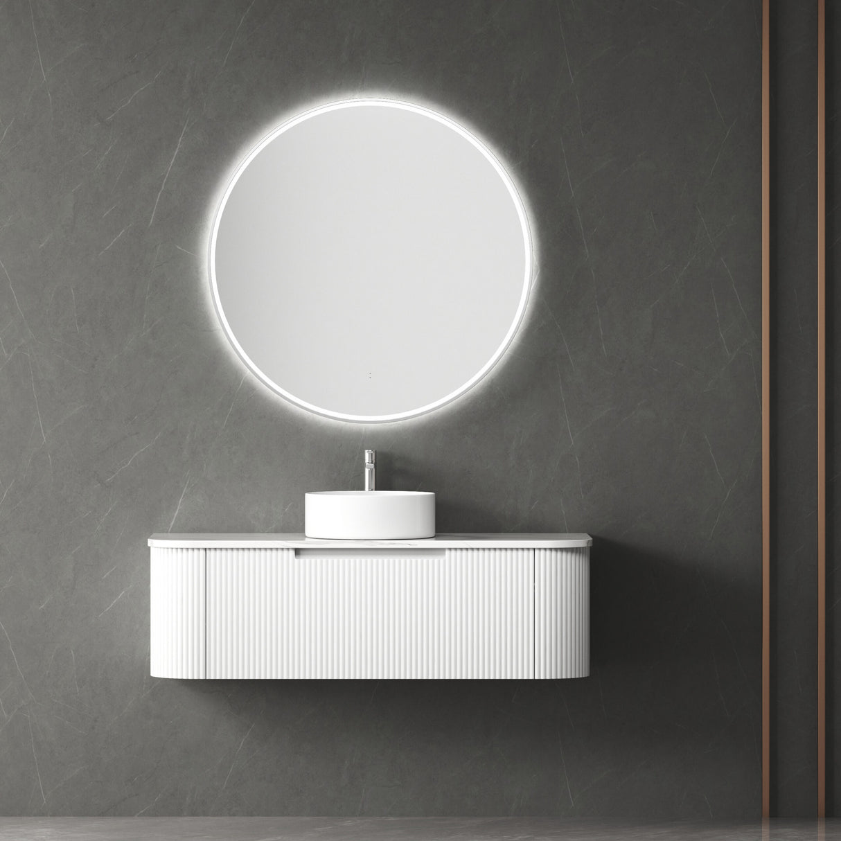 Bathroom vanity with round illuminated mirror on a gray wall