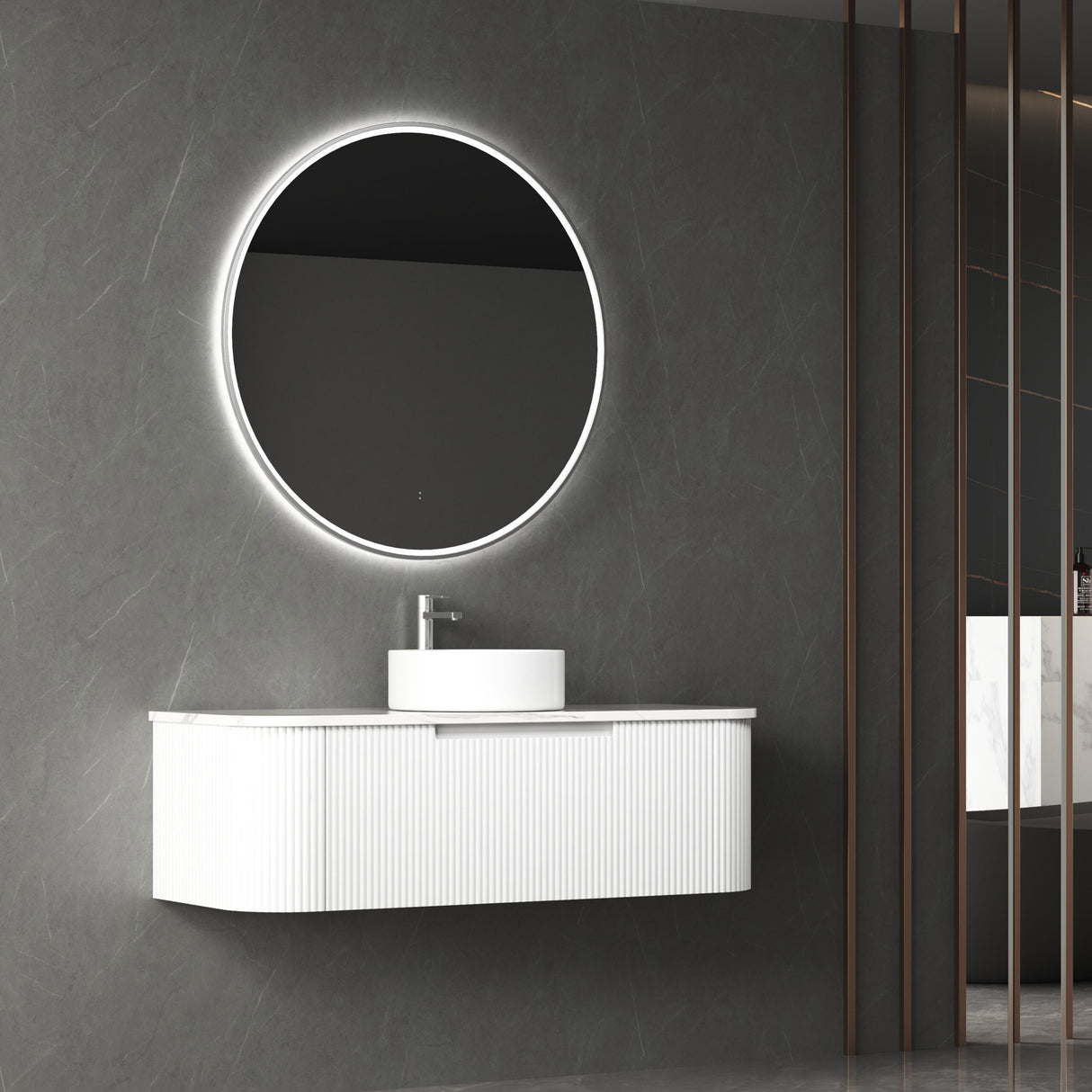 Bathroom vanity with round illuminated mirror on a gray wall