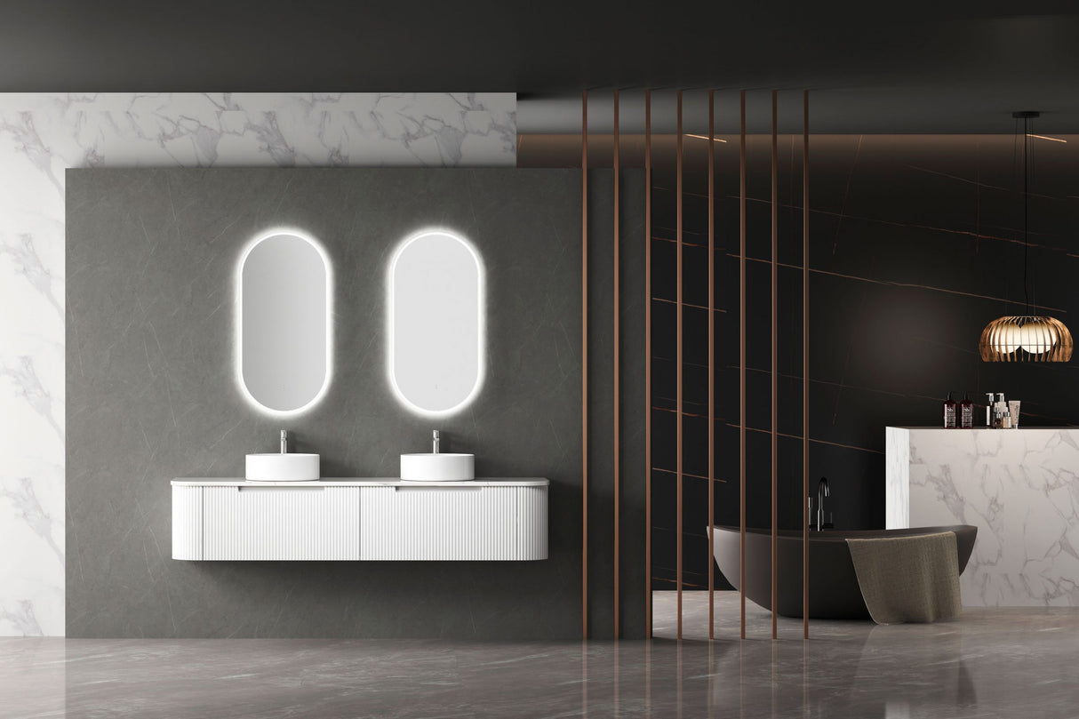 Modern bathroom interior with a vanity, mirrors, and decorative elements.