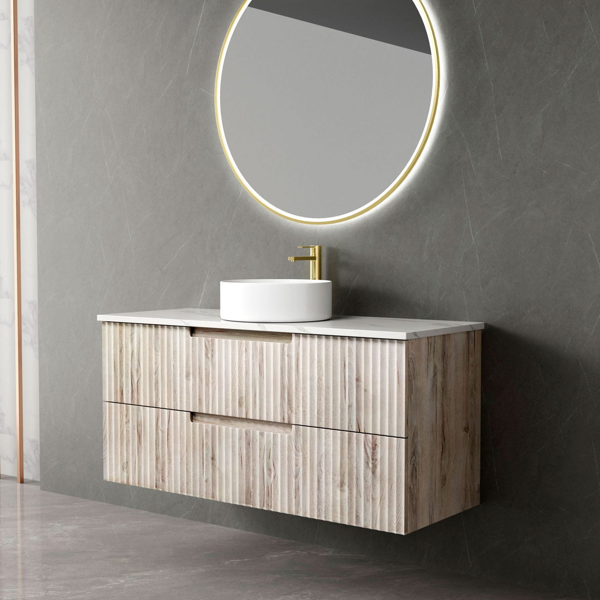 Bathroom vanity with wooden finish, white countertop, and round mirror with lighting on gray wall.