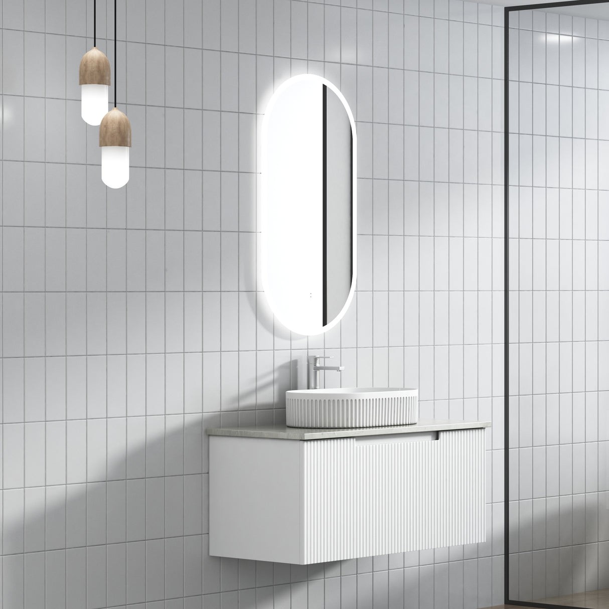 Bathroom with white tiled walls, a vanity unit, and a mirror.