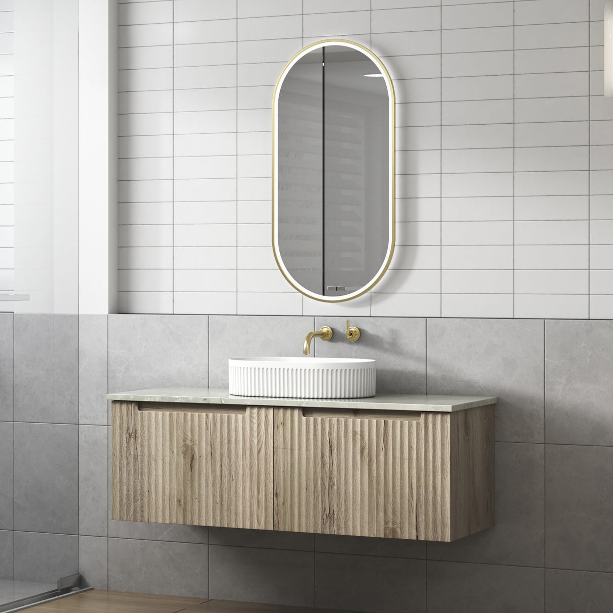 Bathroom vanity with a sink and mirror against a tiled wall.