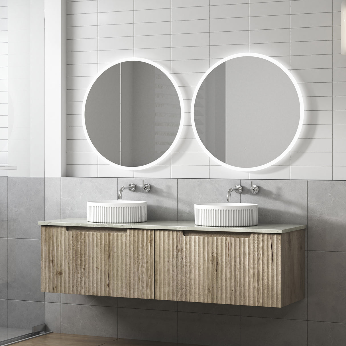 Bathroom vanity with two round mirrors and a wooden cabinet.