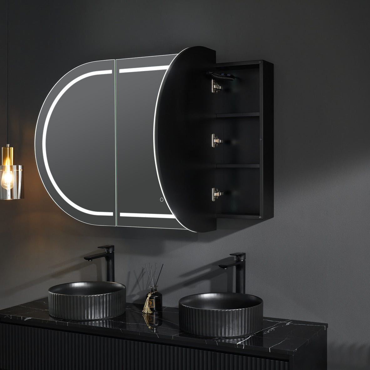 Bathroom setup with a mirror cabinet, sinks, and lighting fixture.