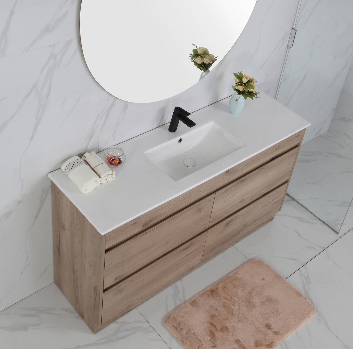Bathroom vanity with wooden cabinet, white countertop, and round mirror.