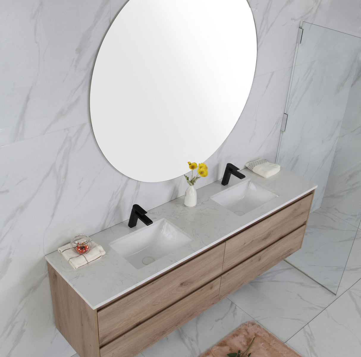 Bathroom vanity with two sinks, mirrors, and decorative items on a marble wall.