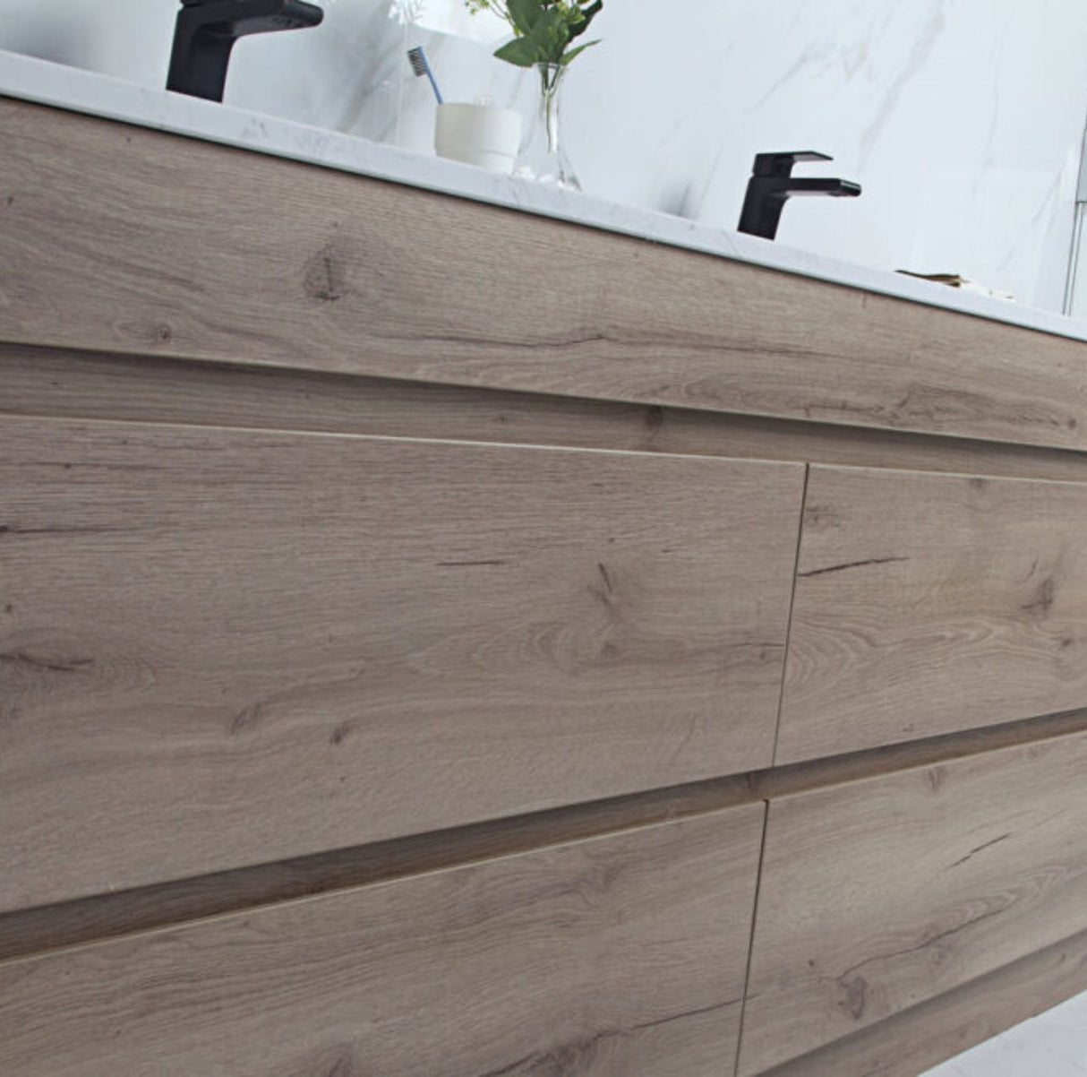Wooden bathroom vanity with a mirror above it