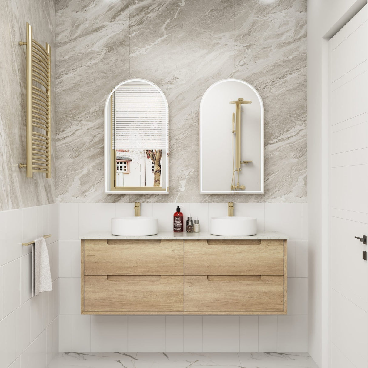 Bathroom with wooden vanity, white sinks, and marble walls.