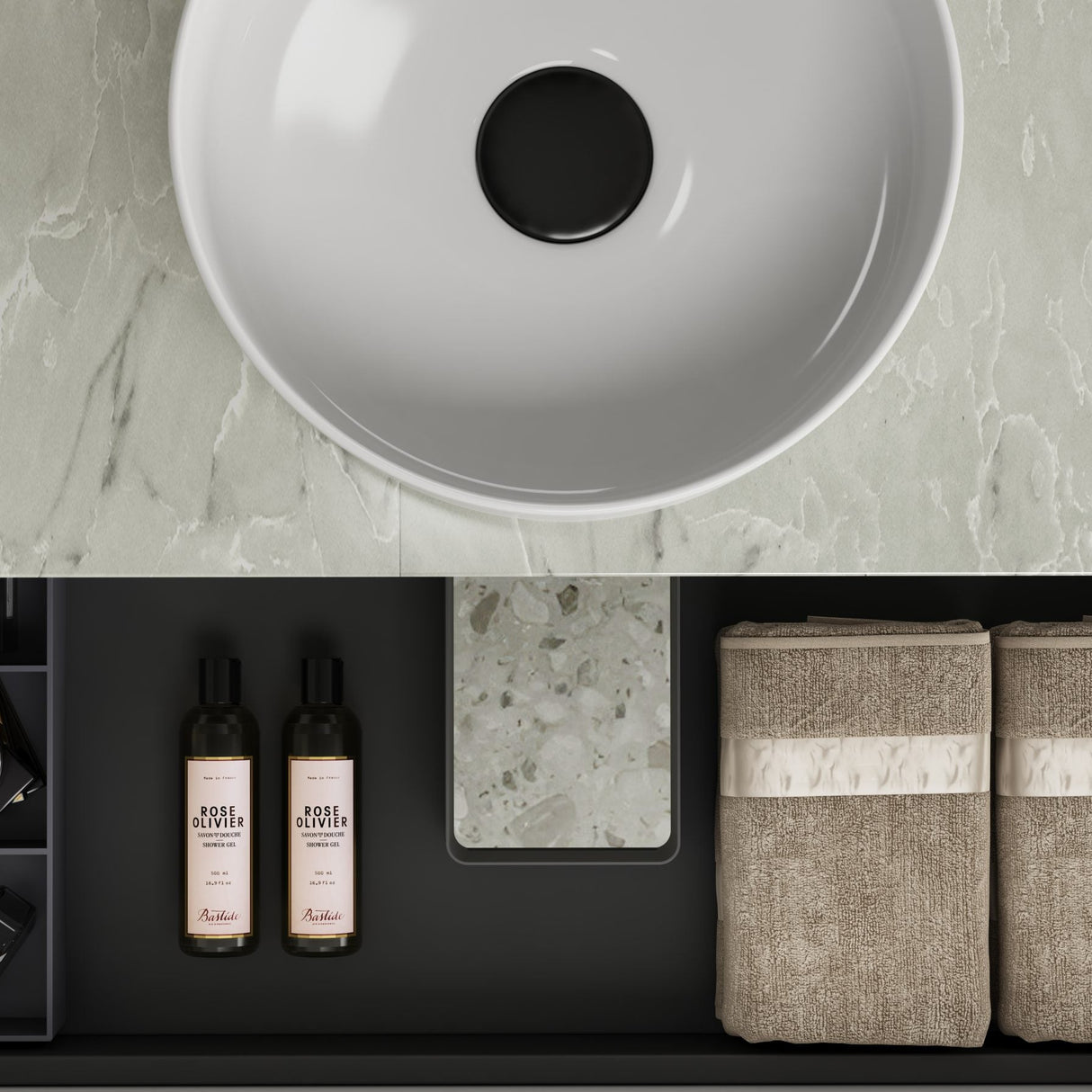 Bathroom setup with a white sink, toiletries, and towels on a marble countertop.