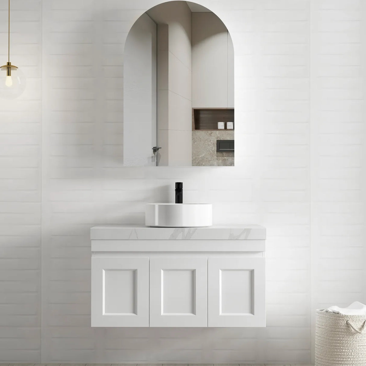 Otti Arched Matte White Shaving Cabinet, complemented by a white vanity with a marble countertop and a modern round basin, set against a textured white wall for a clean and elegant bathroom aesthetic.