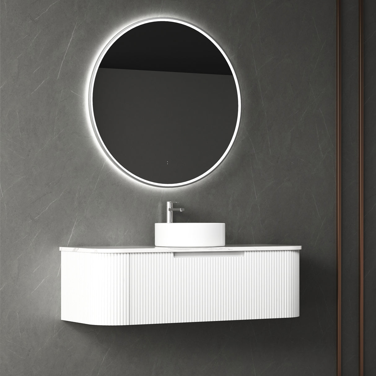 Bathroom vanity with round illuminated mirror on a gray wall