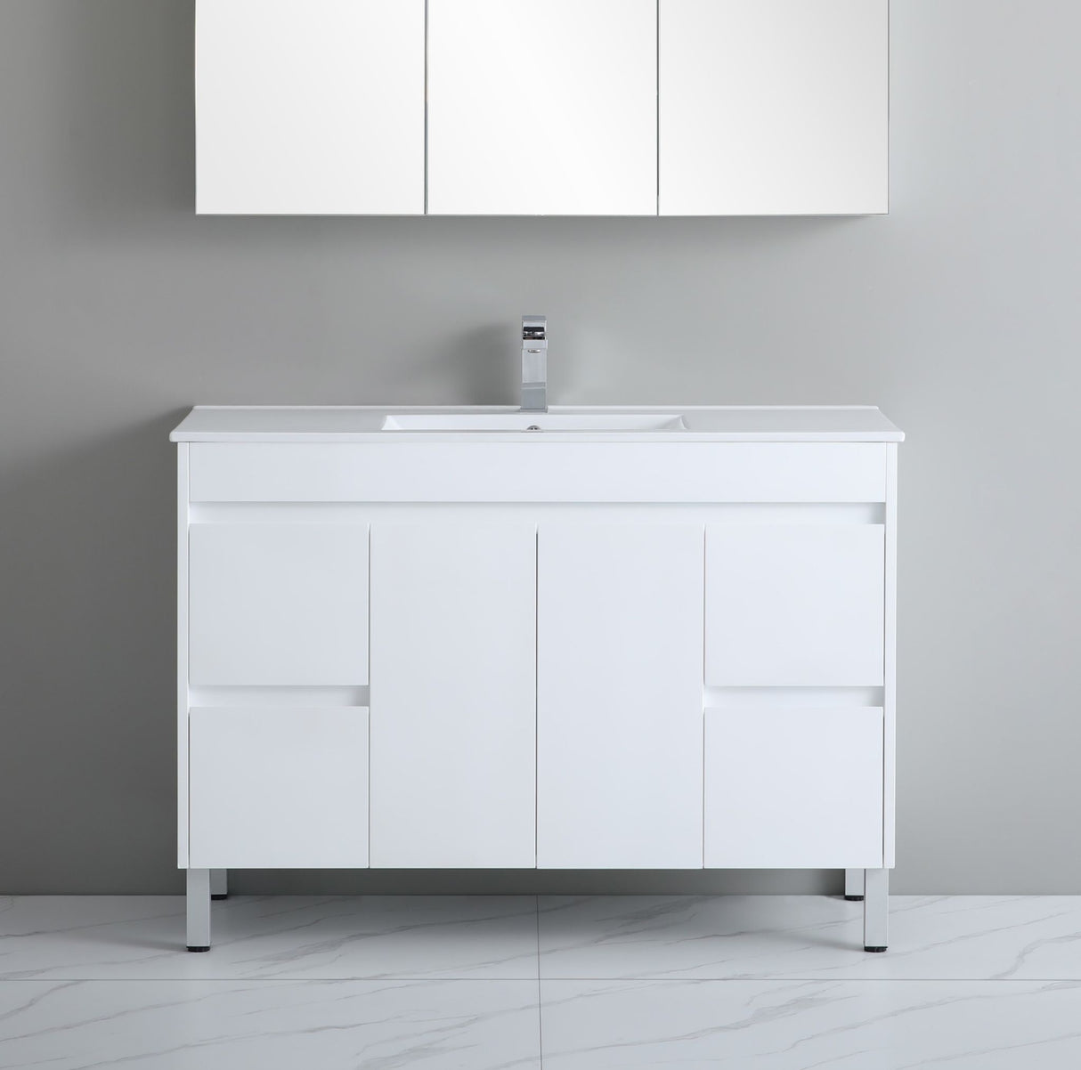 White bathroom vanity with sink against a gray wall