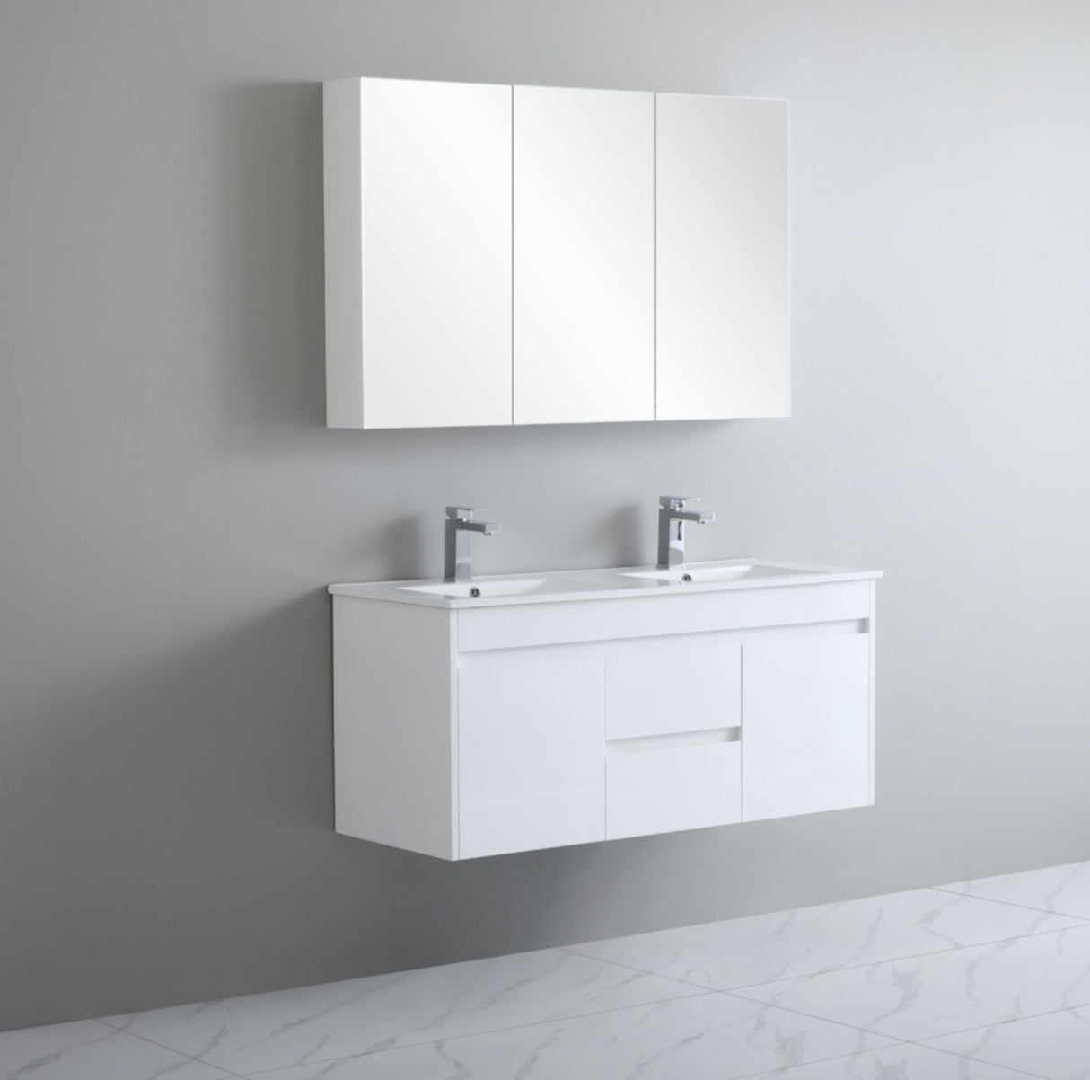 Bathroom vanity with white cabinets and sink against a gray wall.
