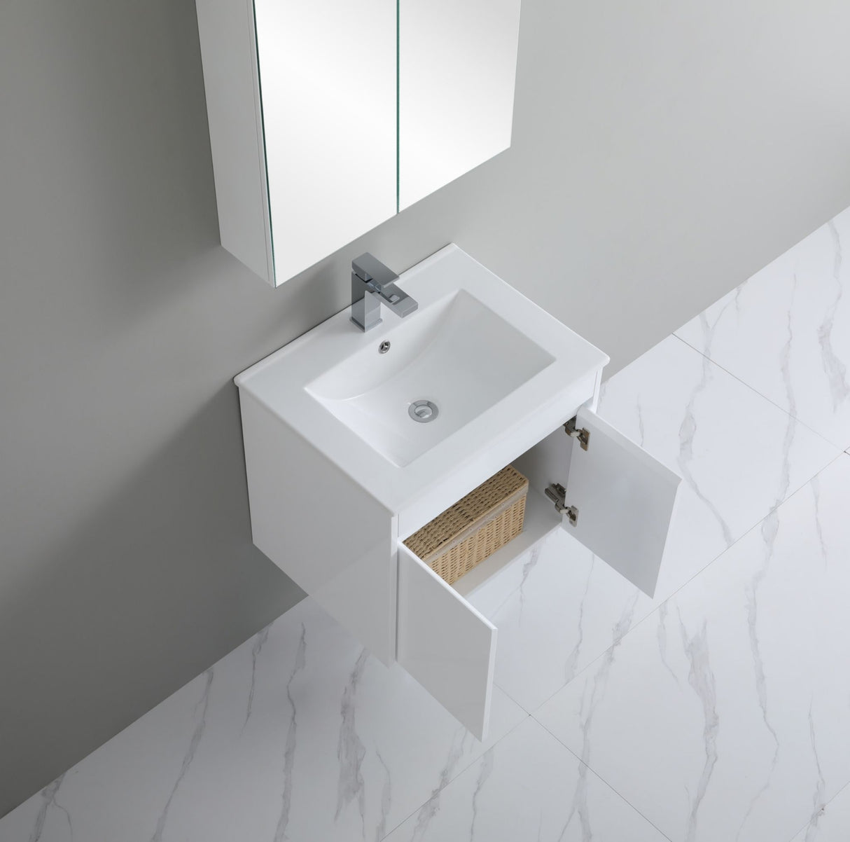 Modern bathroom vanity with sink and mirror in a marble-tiled room