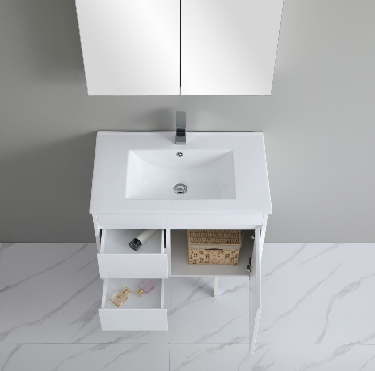 White bathroom vanity with sink and open cabinet doors on a gray marble floor.