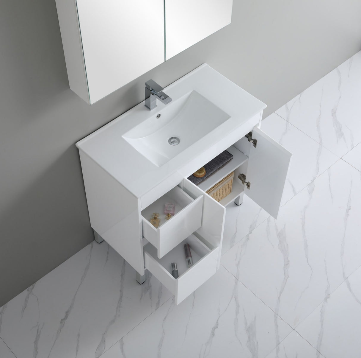 Bathroom vanity with sink and open cabinet doors on a marble floor.