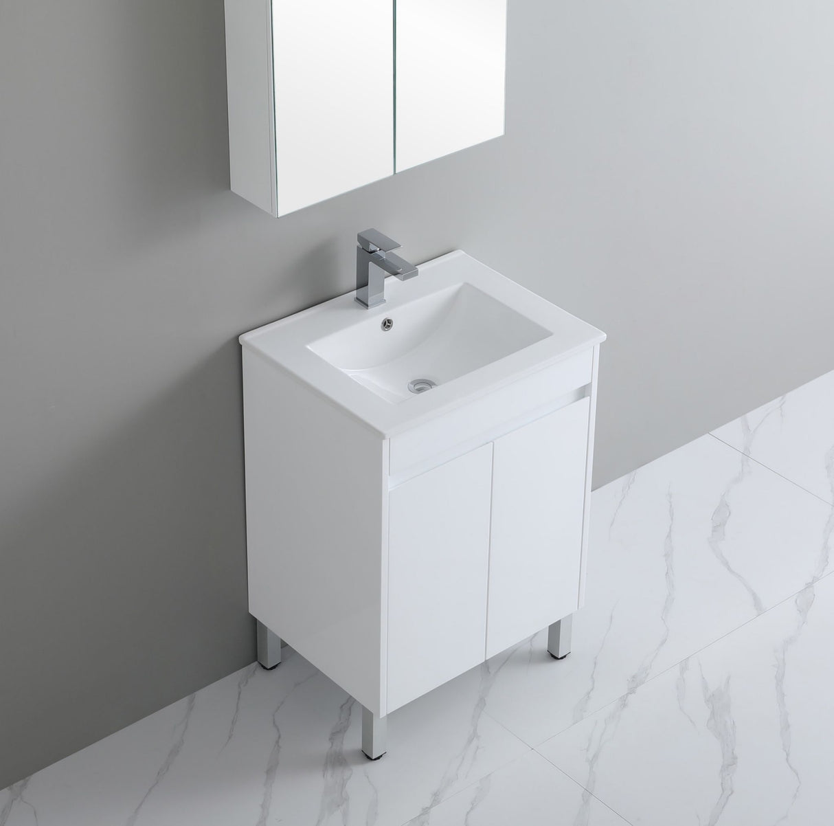 White bathroom vanity with sink against a gray wall