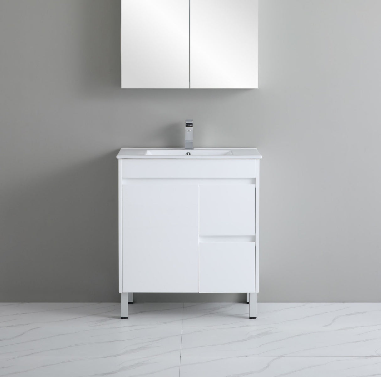 White bathroom vanity with sink against a gray wall
