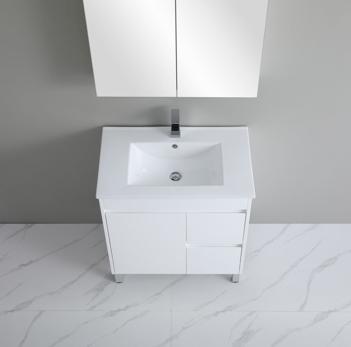 White bathroom vanity with sink against a gray wall