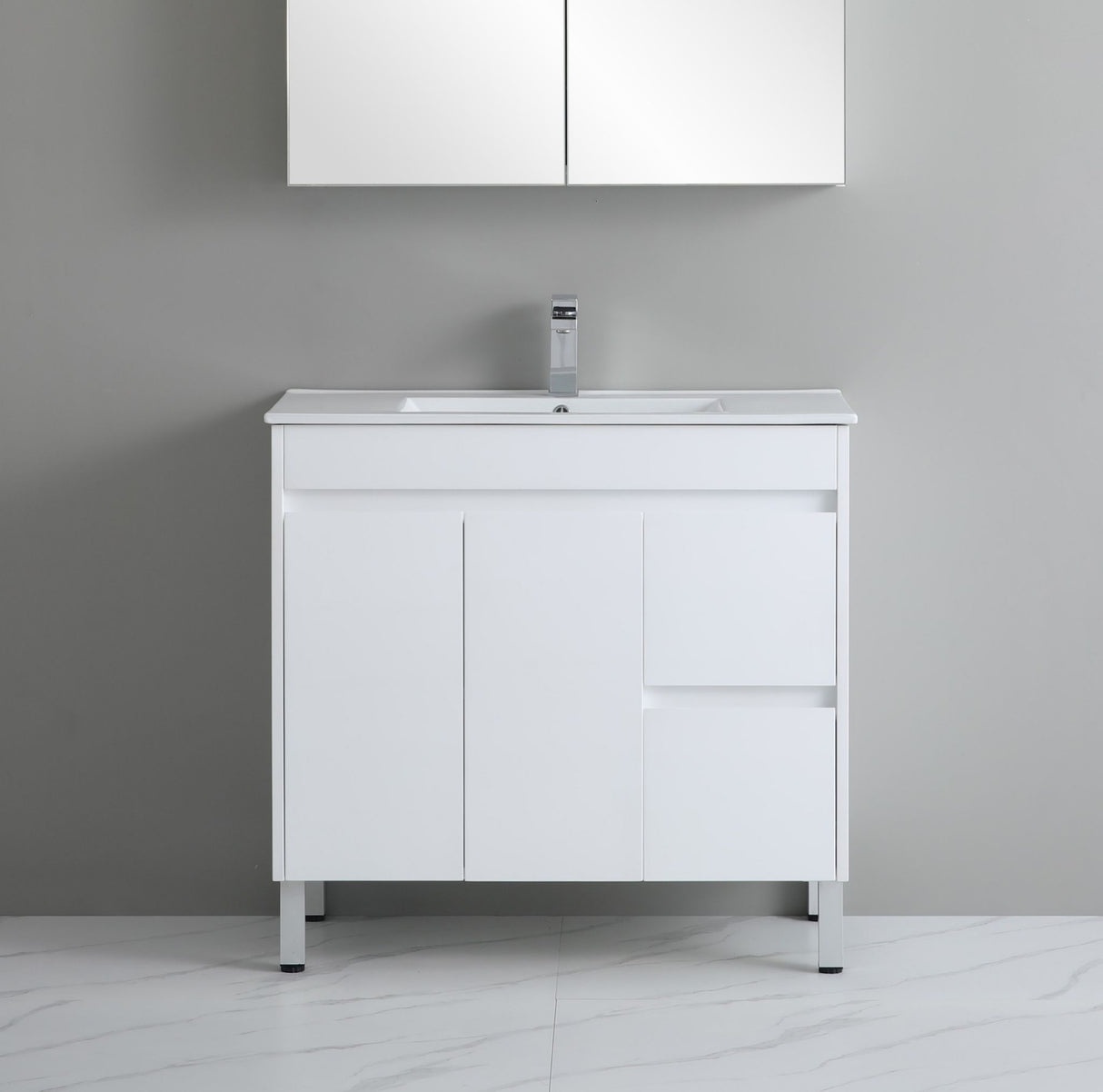 White bathroom vanity with sink against a gray wall