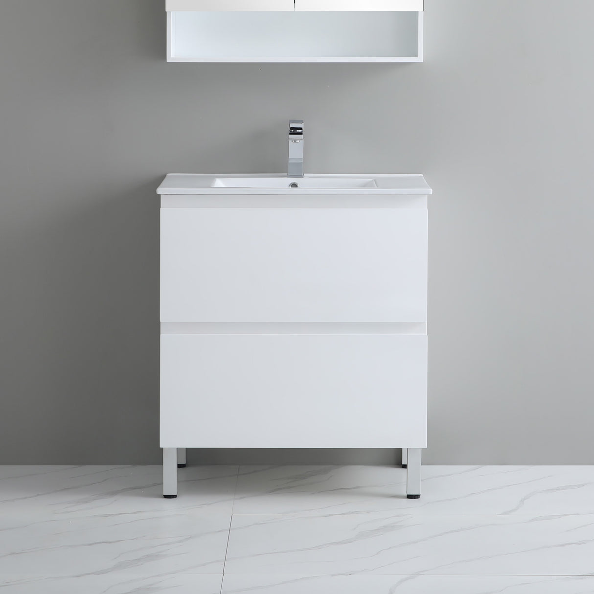 White bathroom vanity with sink against a gray wall