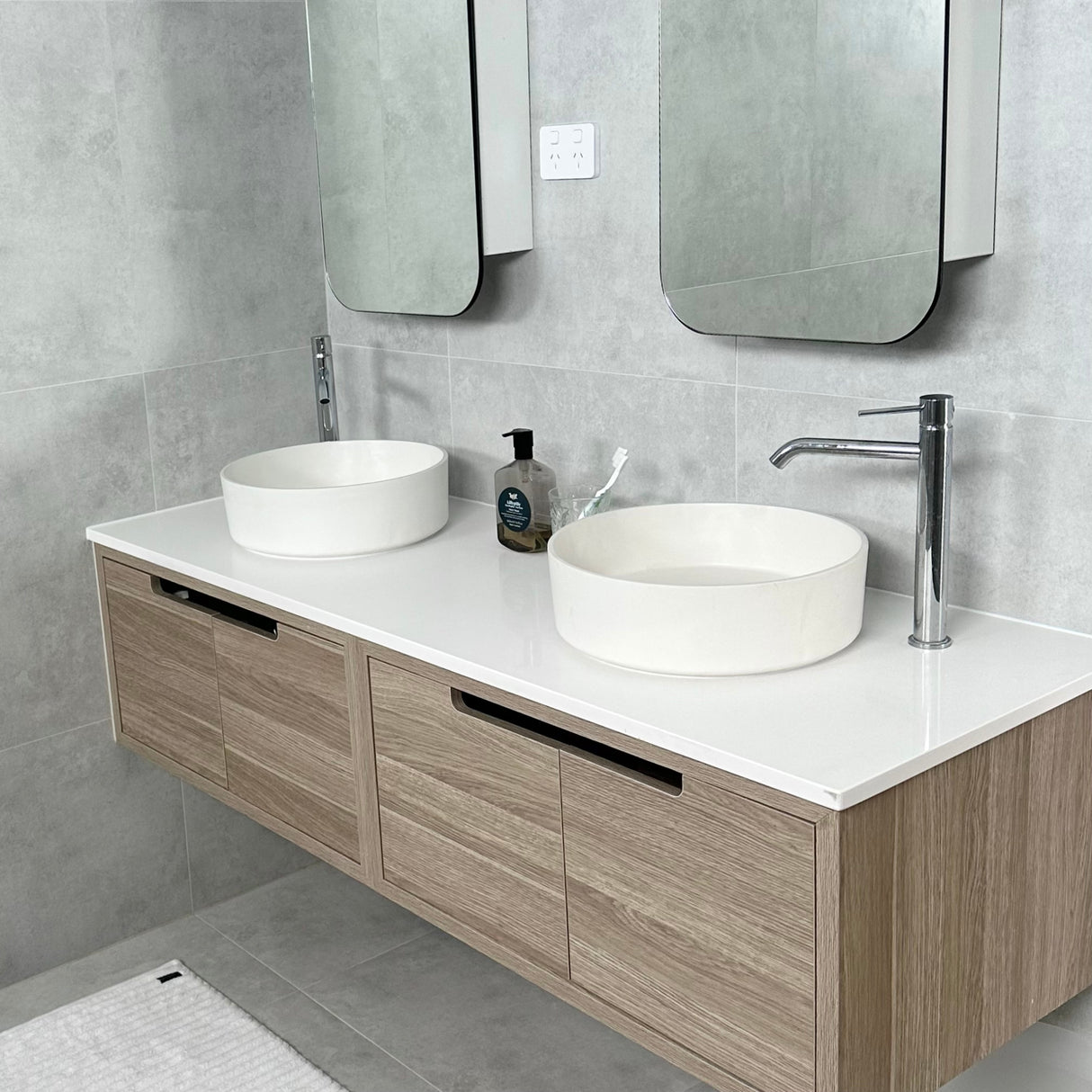 bathroom with installed shaving cabinet, basin tall mixer