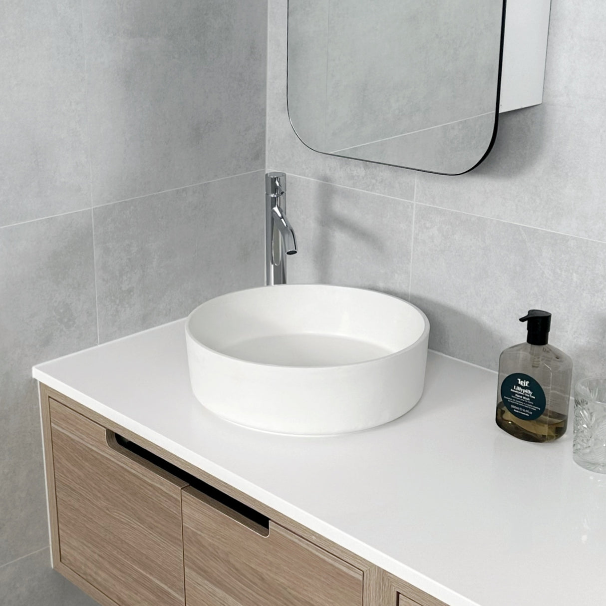 vanity with basin tall mixer and shaving cabinet