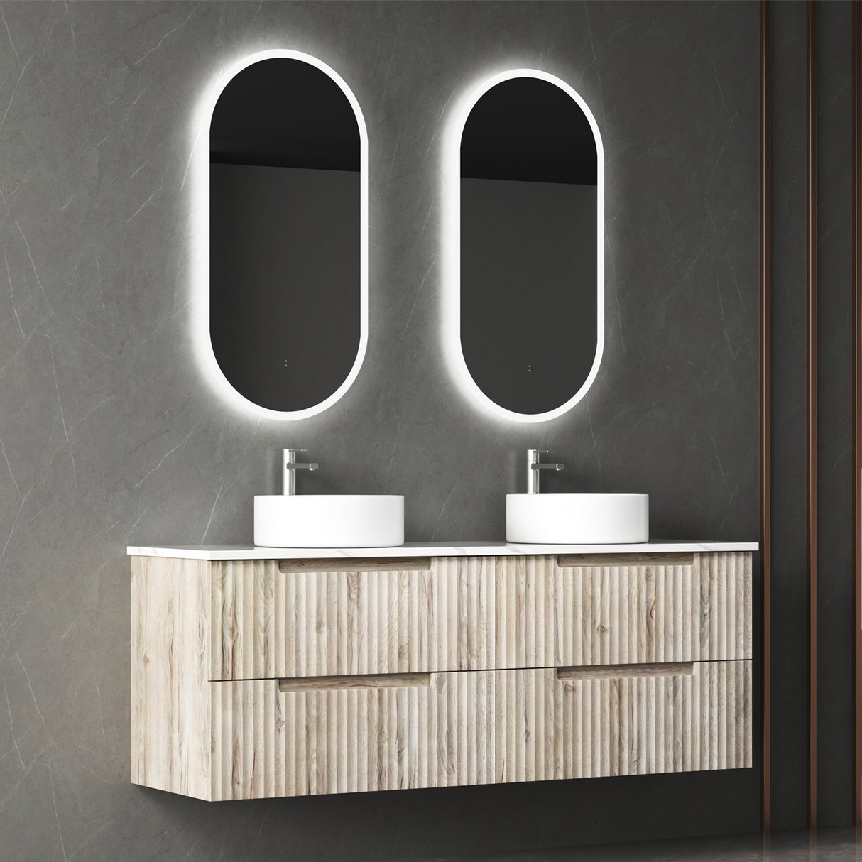 Bathroom vanity with two oval mirrors and white sinks against a dark gray wall.