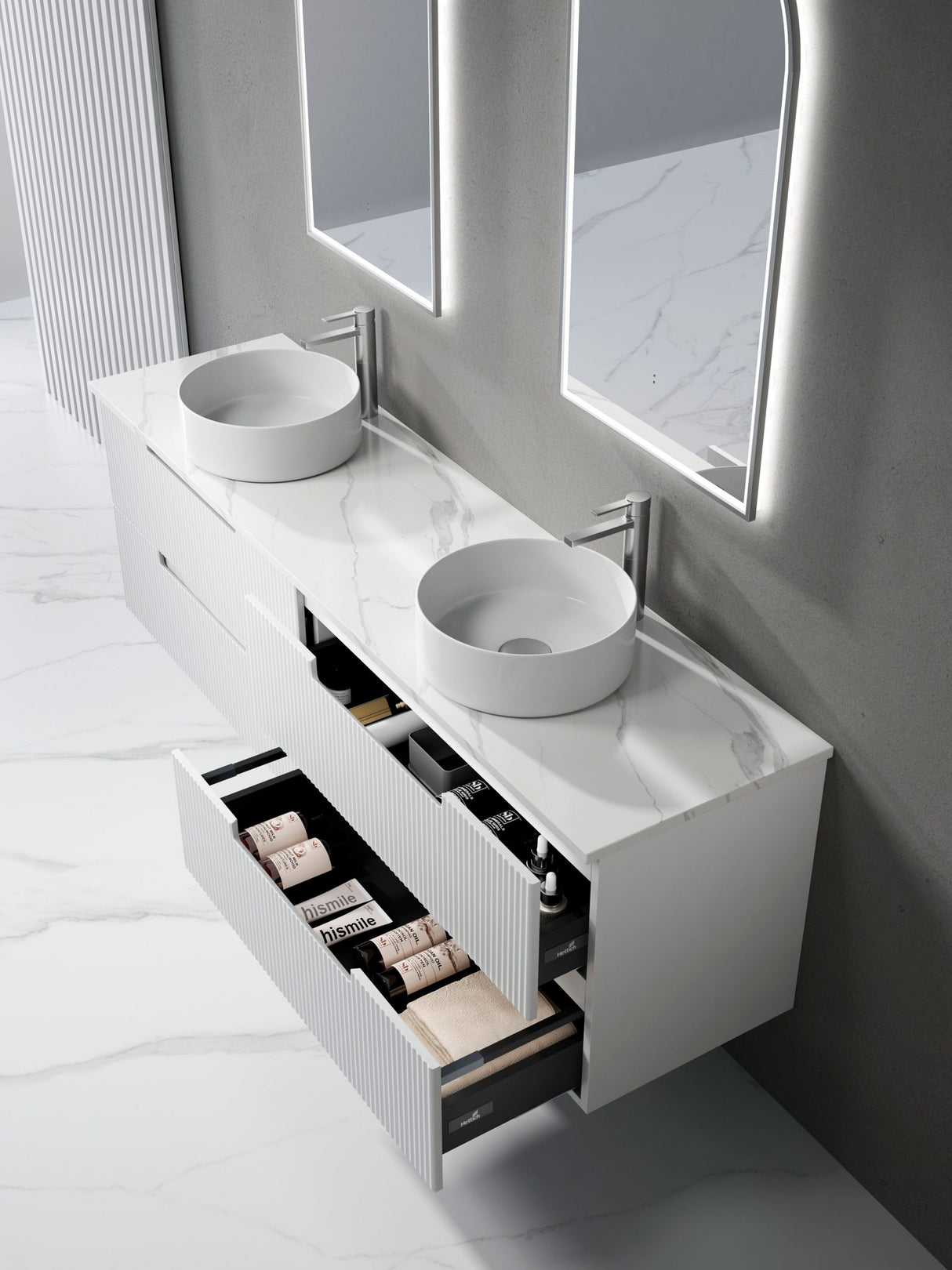 Bathroom vanity with two round sinks and an open drawer displaying toiletries.