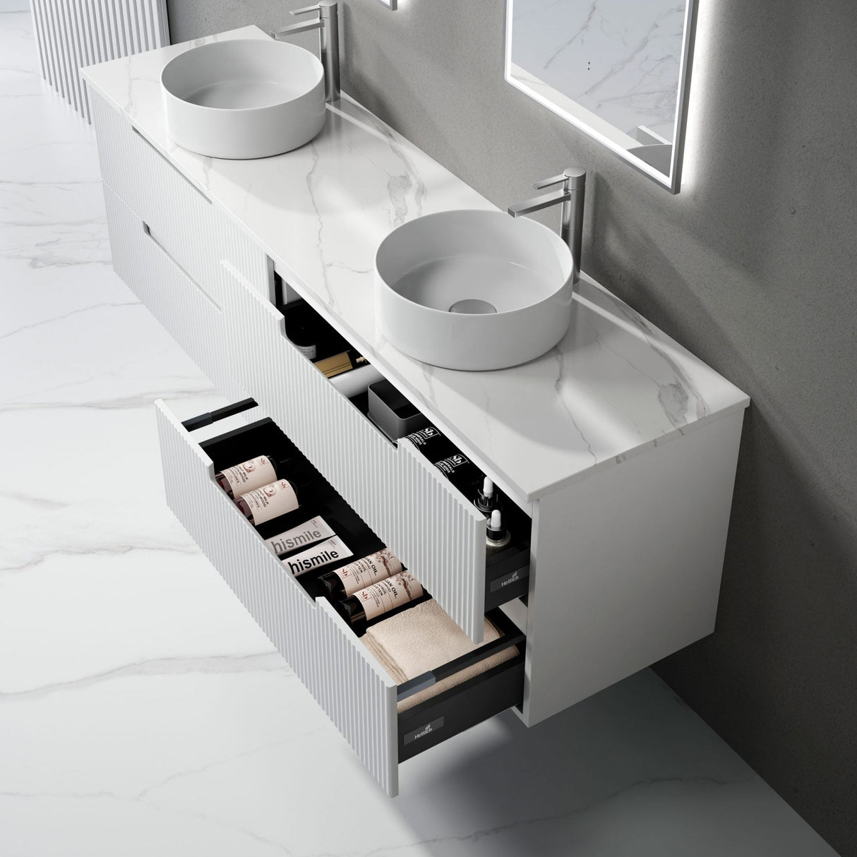Bathroom vanity with two round sinks and an open drawer displaying toiletries.