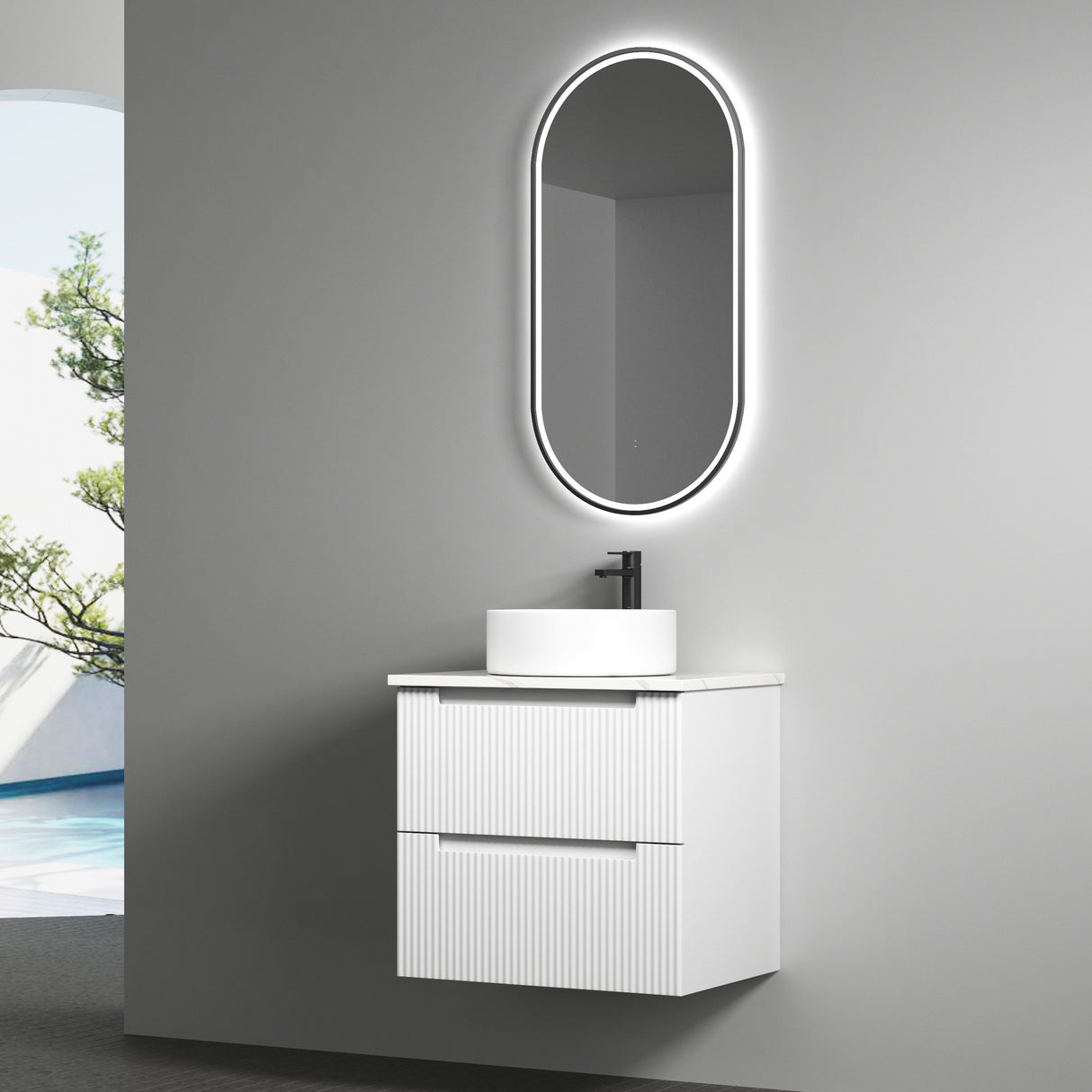 Bathroom vanity with sink and illuminated mirror against a gray wall.