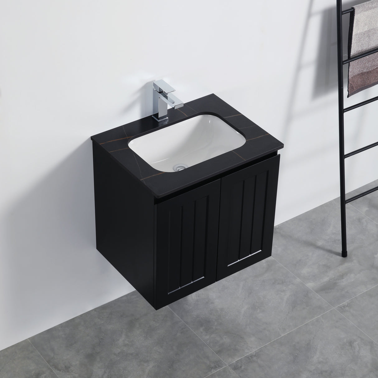 Black vanity unit with white sink mounted on a wall