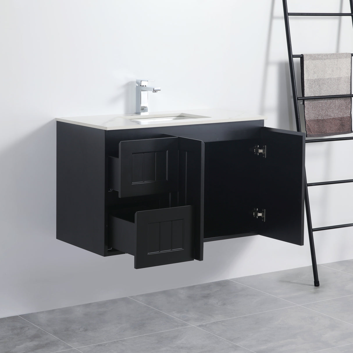 Black bathroom vanity with open cabinet doors on a white wall.