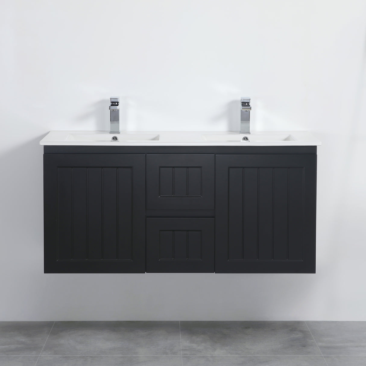 Black double sink vanity unit against a white wall.