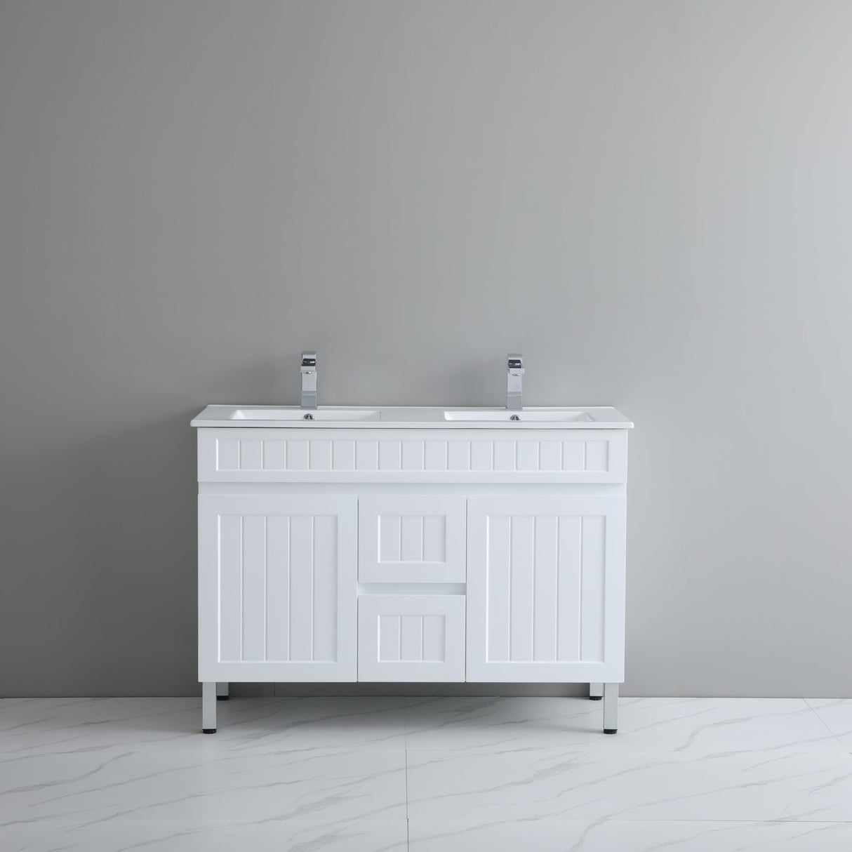 White bathroom vanity with two sinks against a gray wall.