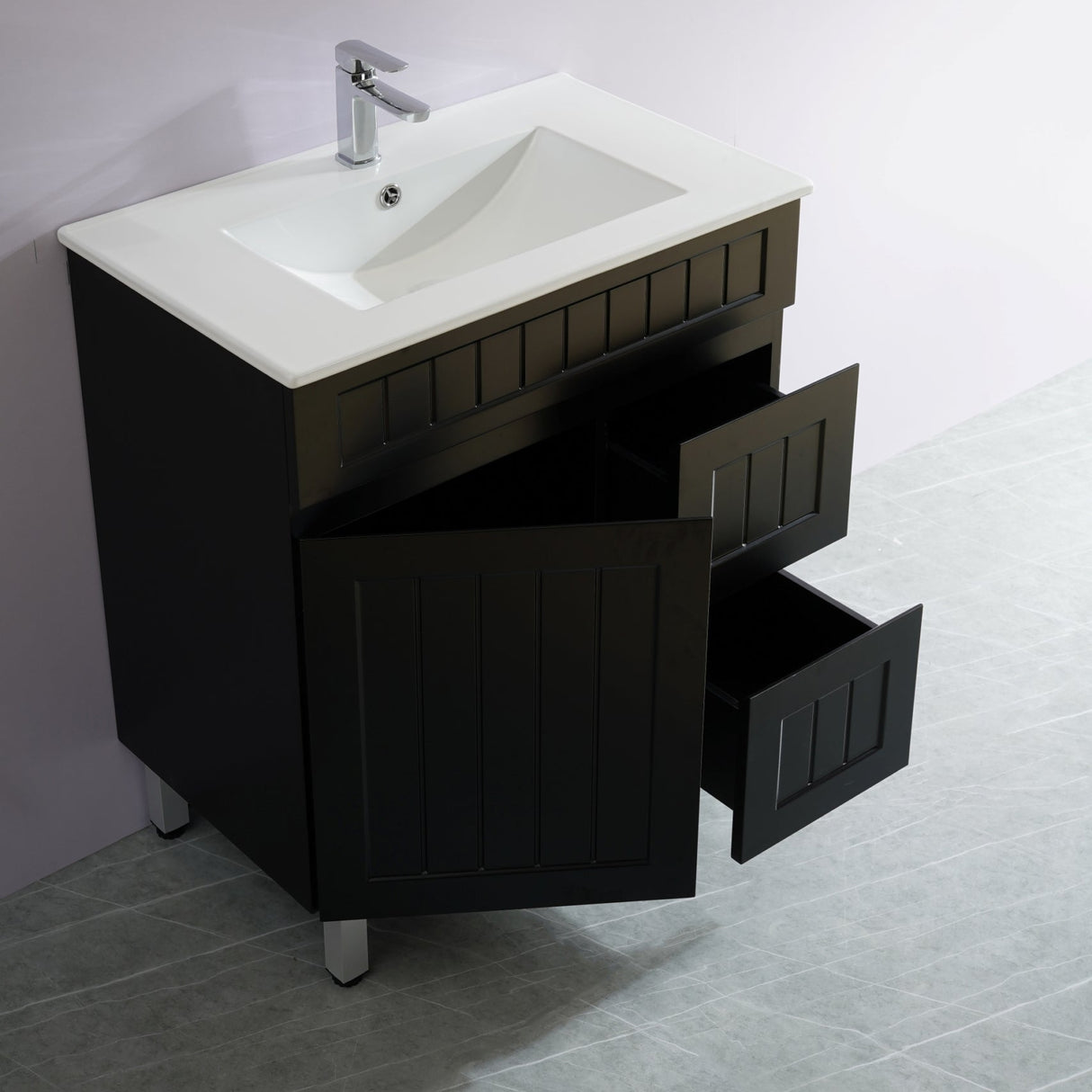 Bathroom vanity with open drawer and sink on a white background