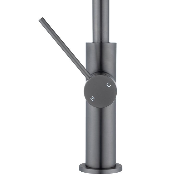 Gunmetal faucet with a control knob on a white background