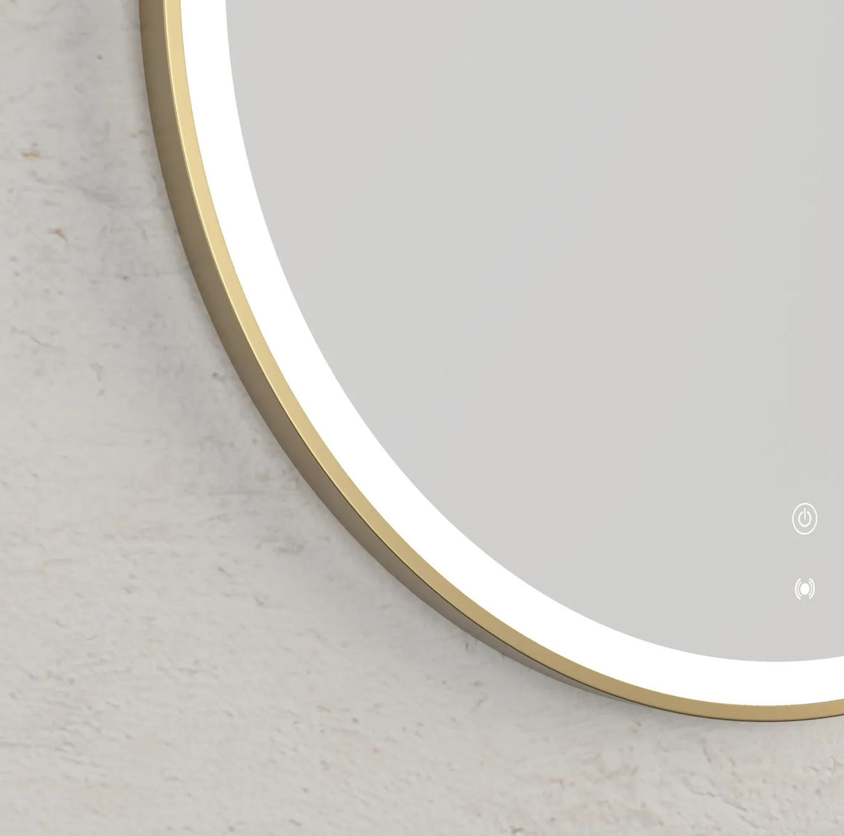 Round mirror with a gold frame on a light gray background