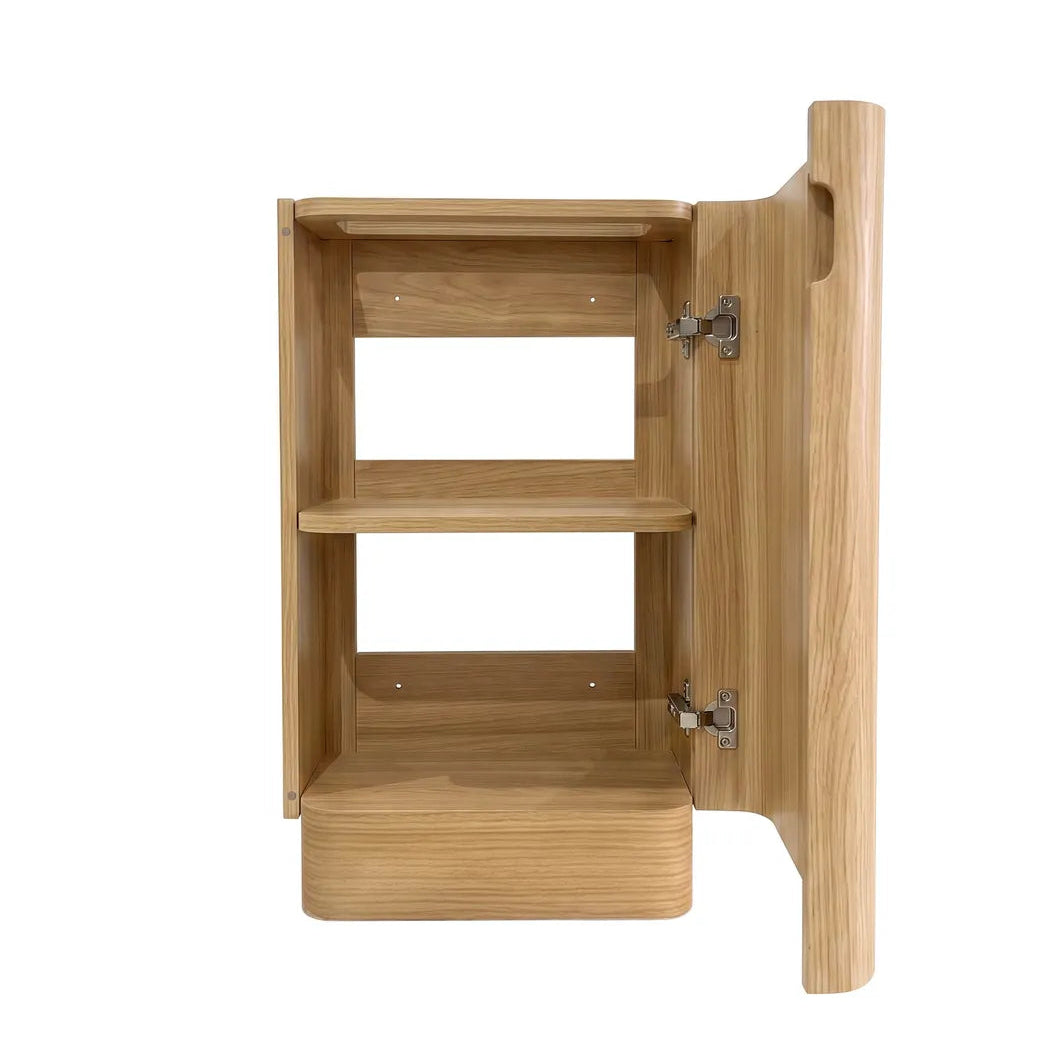 A light oak wood bathroom vanity with two open shelves and an open door, shown against a plain white background.