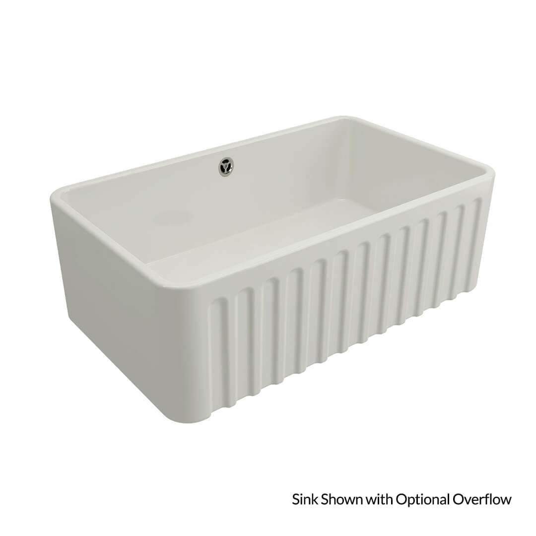 White ceramic sink with ribbed design on a white background